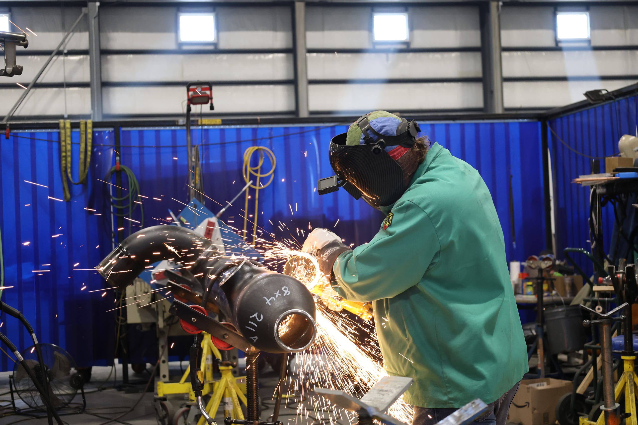 UPI pipefitter welding in the fabrication shop