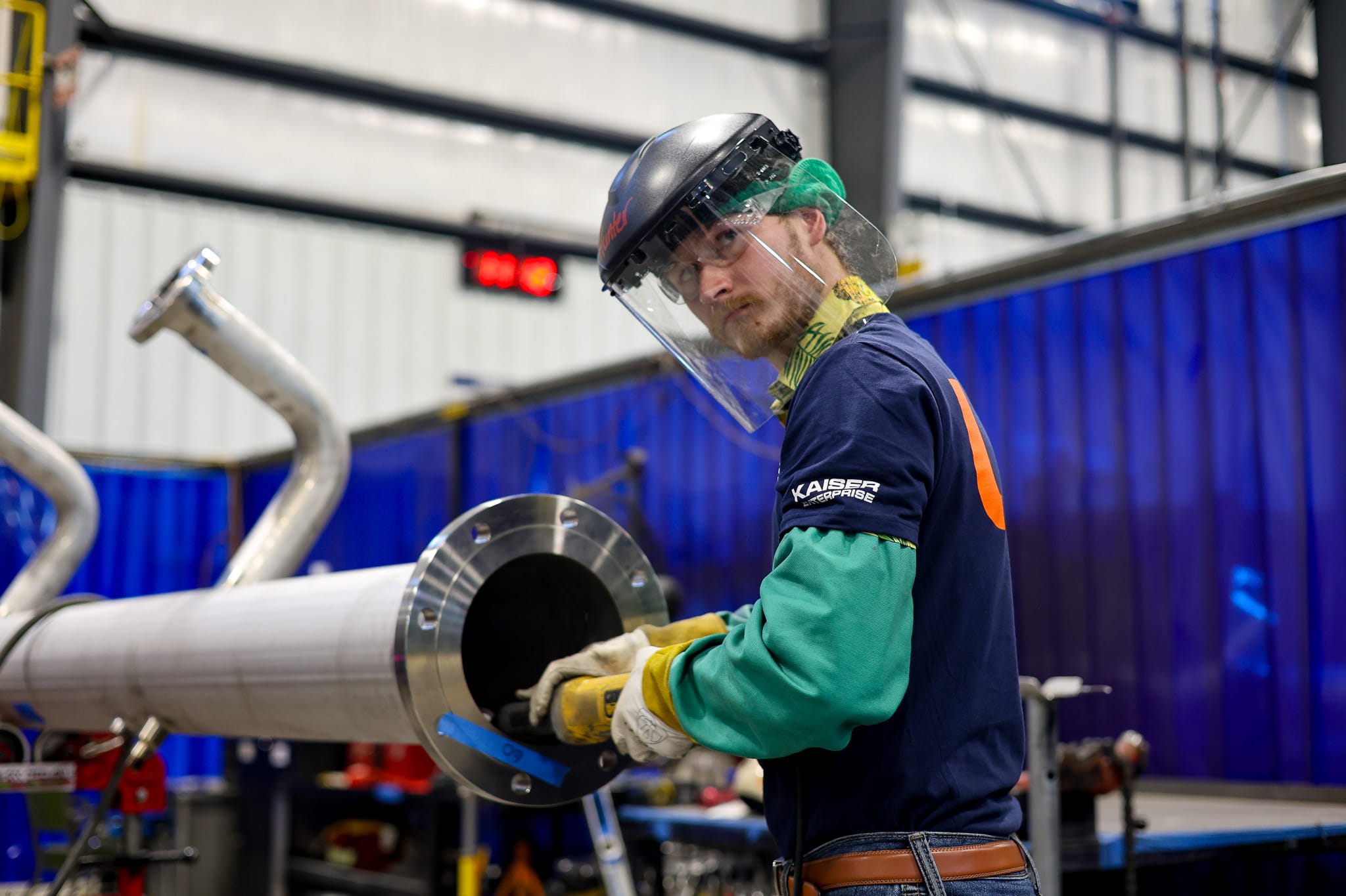 UPI fabricator preparing an industrial piping assembly