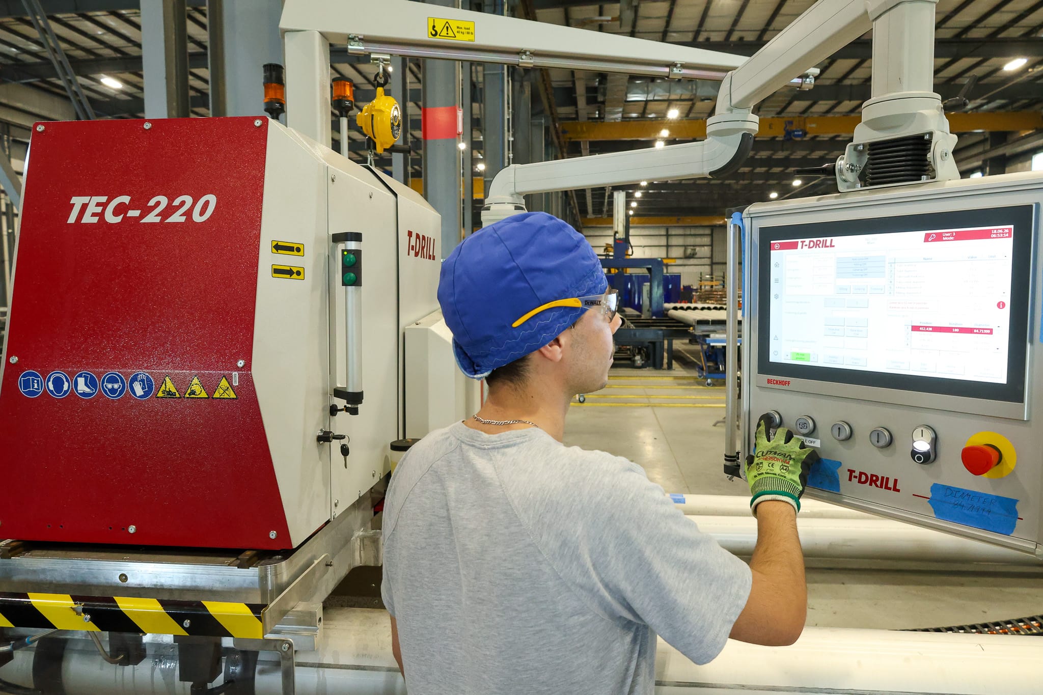 UPI team member operating digital manufacturing equipment