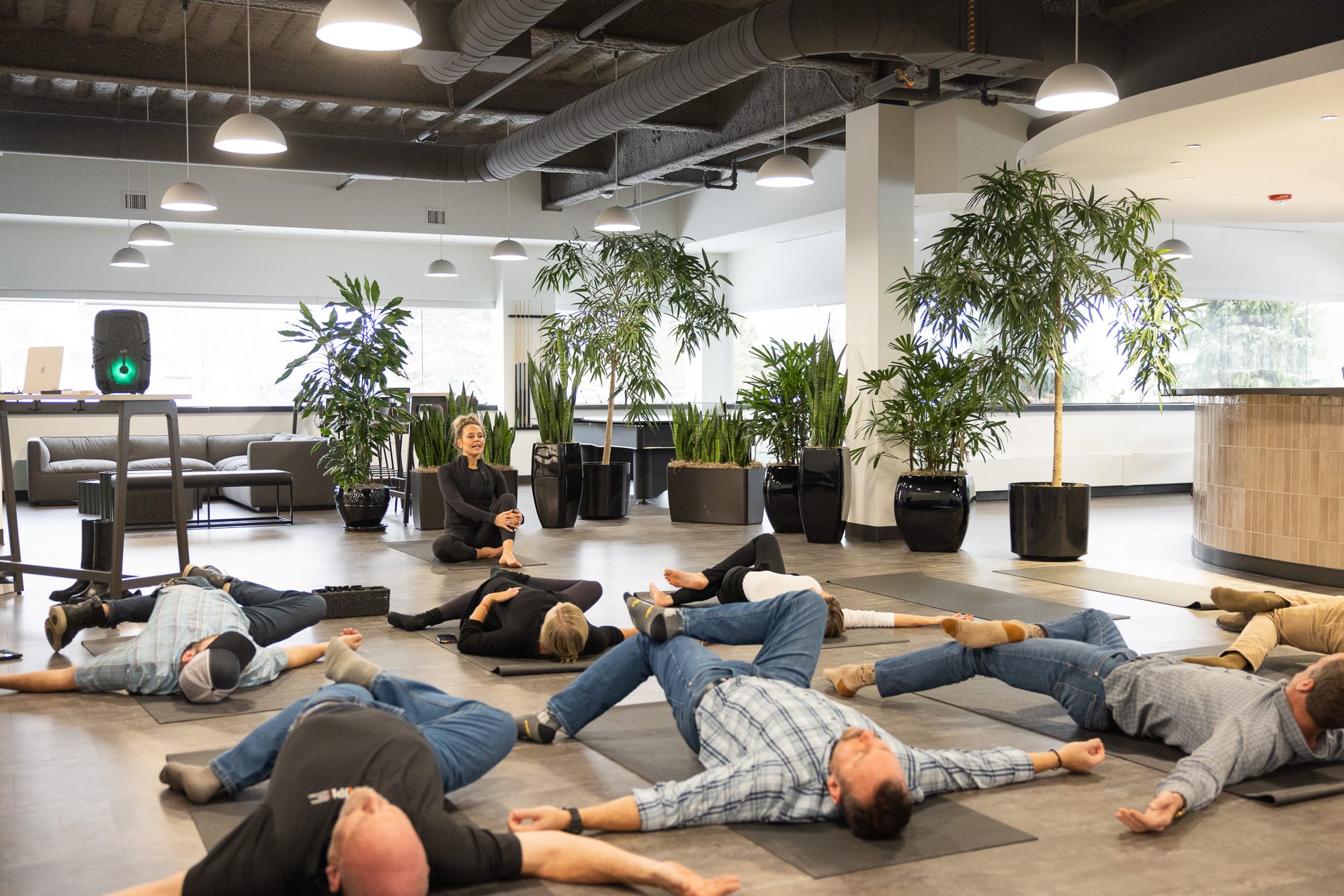 Team members participating in a guided wellness session