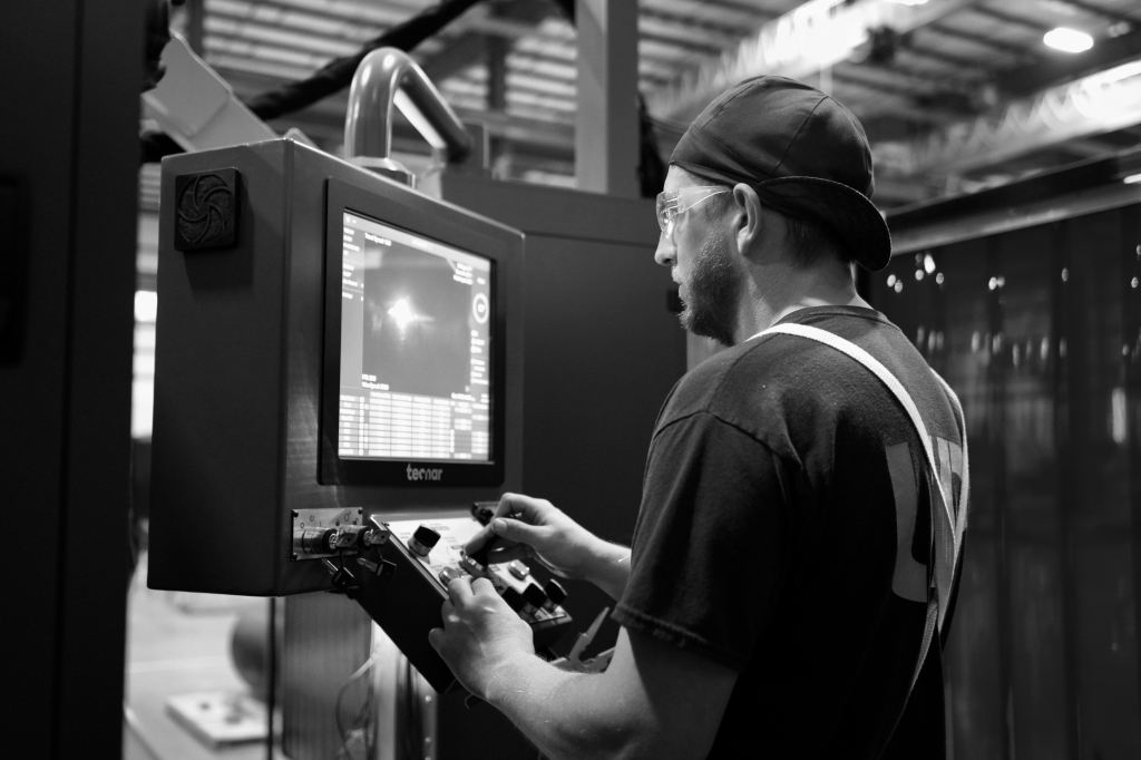 UPI team member operating fabrication equipment