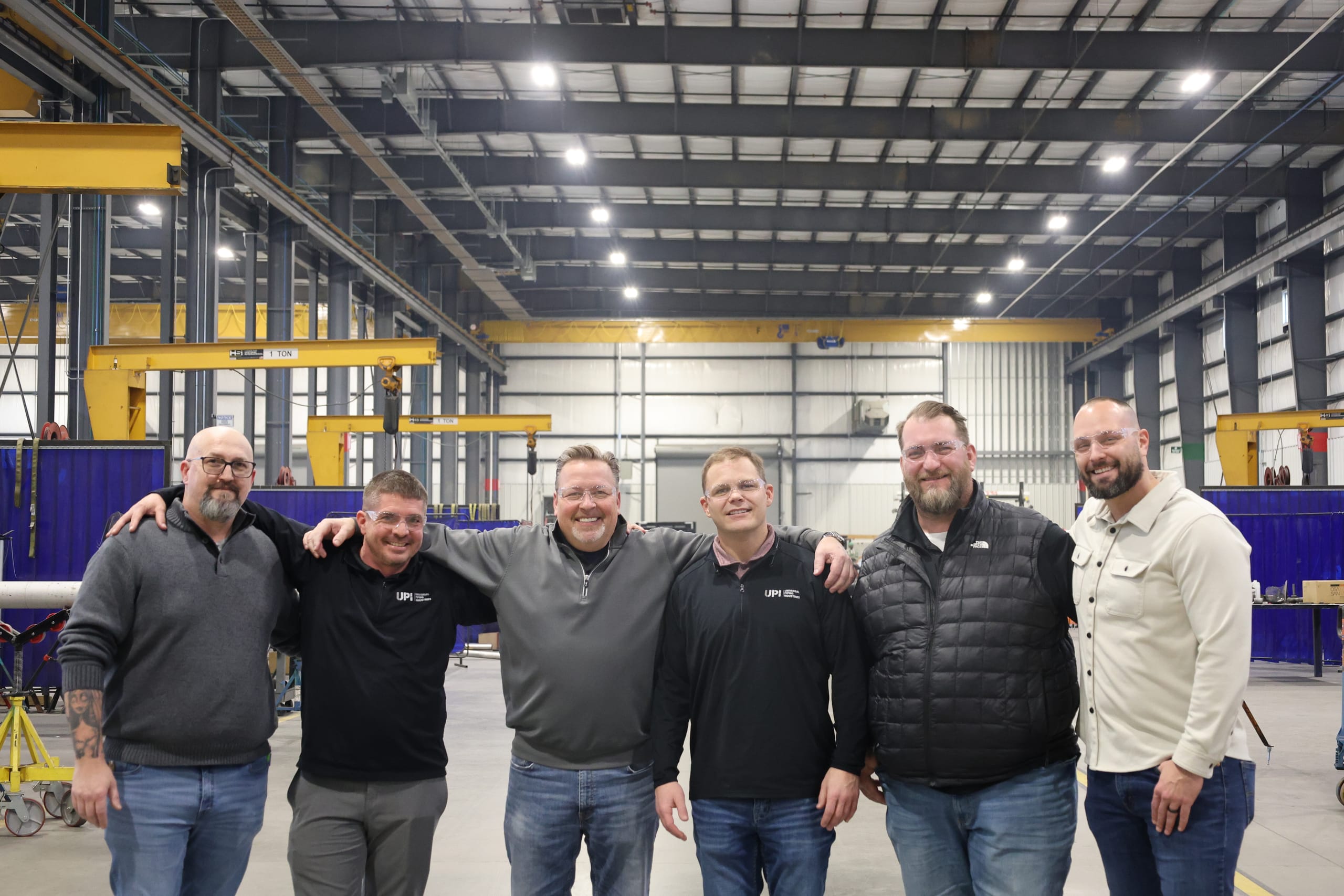 UPI team members together in the fabrication facility