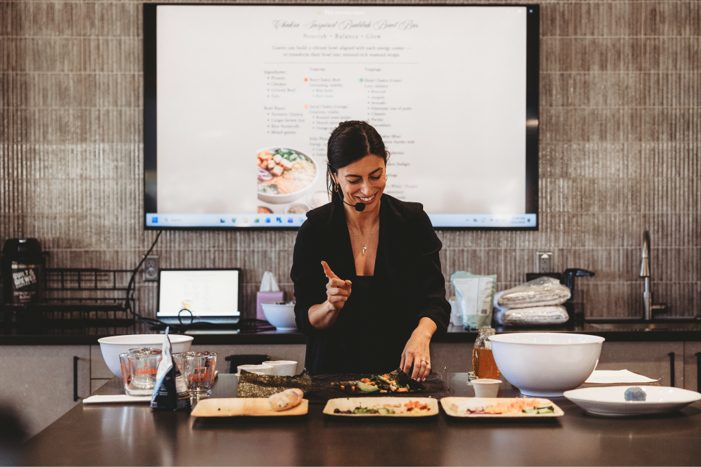 A facilitator demonstrating healthy meal preparation